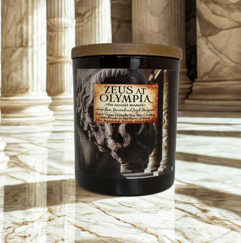 Candle labeled 'Zeus at Olympia' in a marble setting