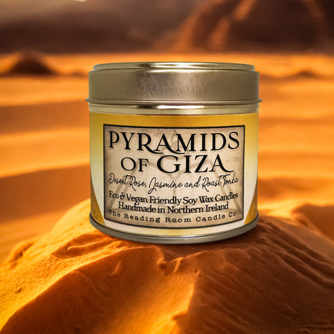 Candle tin labeled 'Pyramids of Giza' in a desert setting