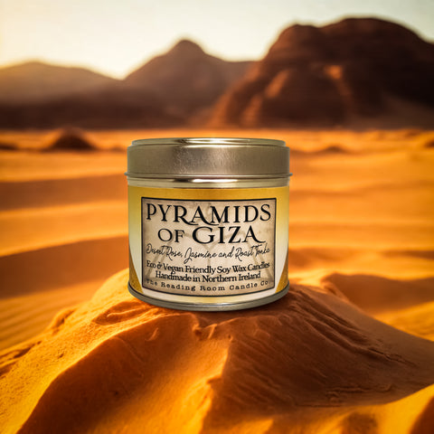 Candle tin labeled 'Pyramids of Giza' in a desert setting