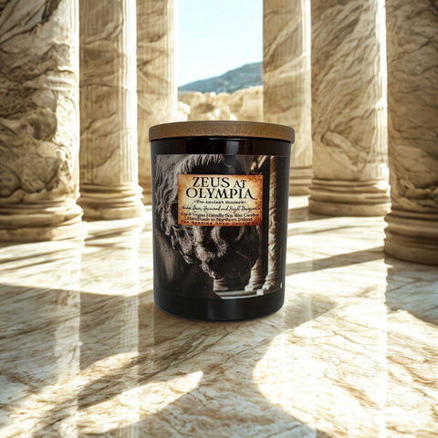 Candle labeled 'Zeus at Olympia' in a classical temple setting