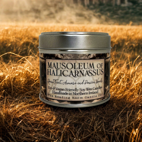 Candle jar labeled 'Mausoleum of Halicarnassus' in a field with ruins in the background