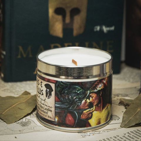 Candle with 'The Song of Achilles' book in the background
