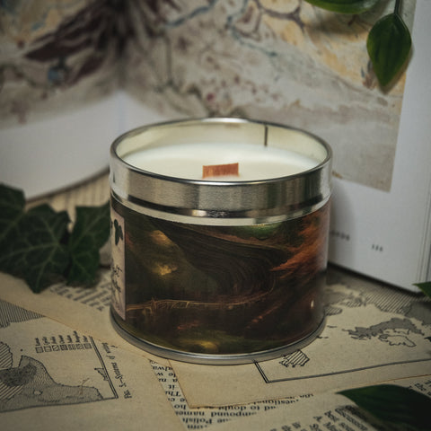 Soy Wax Candle tin labeled 'The Forest of the Elves' on a surface with a blurred natural background
