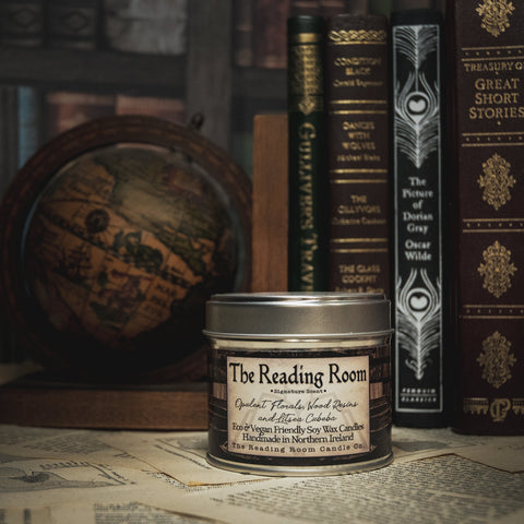 Soy Wax Candle Candle labeled 'The Reading Room' with vintage books in the background