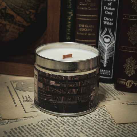 Soy Wax Candle Candle labeled 'The Reading Room' with vintage books in the background