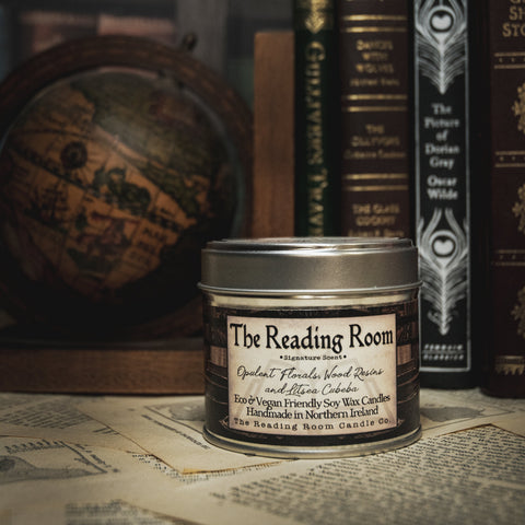 Soy Wax Candle Candle labeled 'The Reading Room' with vintage books in the background