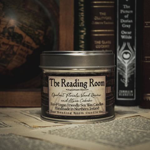 Soy Wax Candle Candle labeled 'The Reading Room' with vintage books in the background