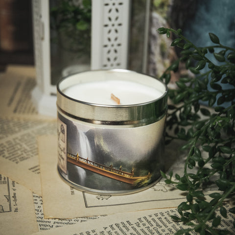 Soy Wax Elven Valley candle in a tin with a decorative background