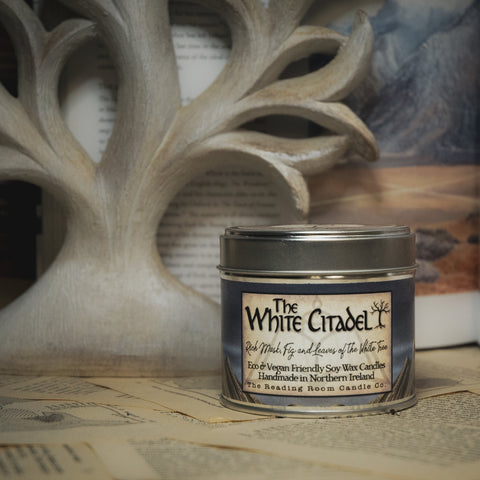 Soy Wax Candle tin labeled 'The White Citadel' on a rustic background with the white tree.